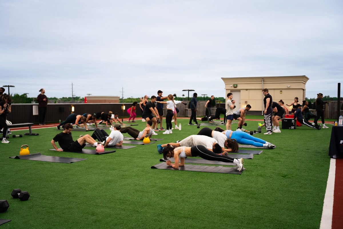 Group fitness class on ACE rooftop turf