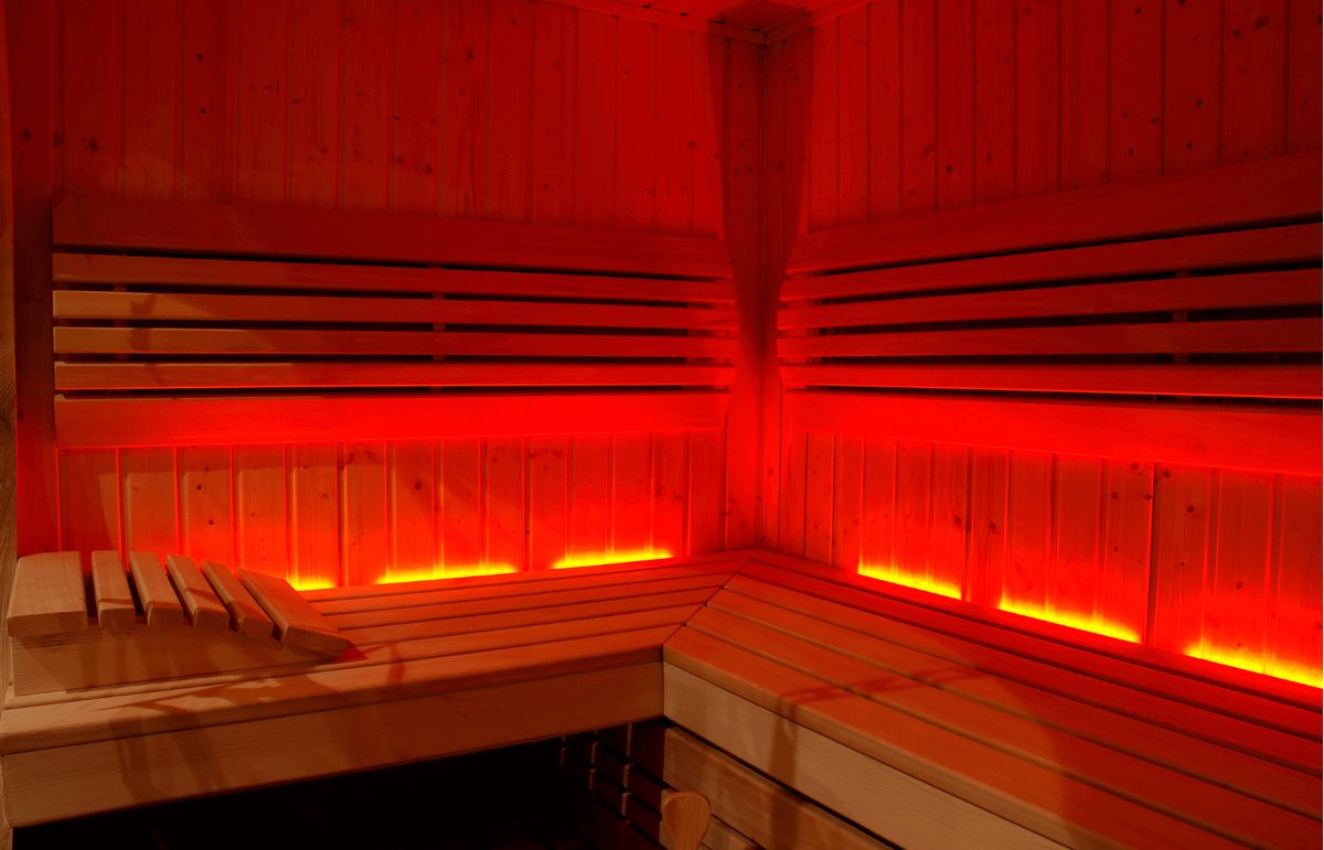 ACE infrared sauna with red ambient lighting